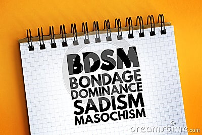 BDSM - Bondage, Dominance, Sadism, Masochism acronym on notepad, concept background Stock Photo