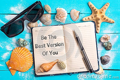 Be the best version of you text in notebook with Few Marine Items Stock Photo