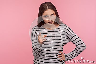 Be careful, I`m warning! Portrait of strict bossy brunette woman in striped sweatshirt giving advice, scolding Stock Photo