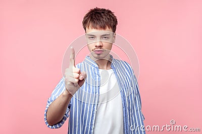 Be careful! Portrait of bossy brown-haired man with small beard and mustache showing warning sign, caution. isolated on pink Stock Photo