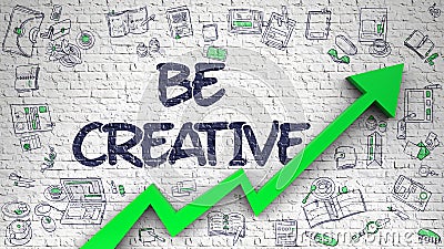 Be Creative Drawn on White Wall. Stock Photo