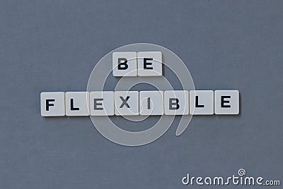 & x27; Be Flexible & x27; word made of square letter word on grey background Stock Photo