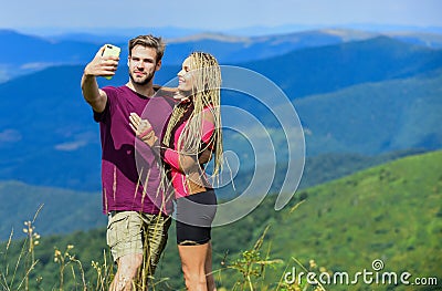 Be happy. man and woman in mountains. sense of freedom. Traveling couple make selfie. romantic selfie. Valentines day Stock Photo
