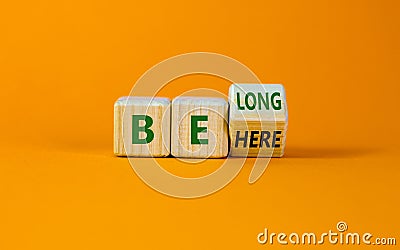 Be here belong symbol. Turned a cube and changed words 'be here' to 'belong'. Stock Photo
