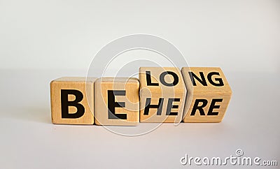 Be here belong symbol. Turned cubes and changed words `be here` to `belong`. Beautiful white background. Business, belonging a Stock Photo