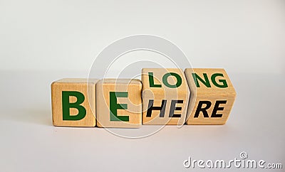 Be here belong symbol. Turned cubes and changed words `be here` to `belong`. Beautiful white background. Business, belonging a Stock Photo