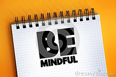 Be Mindful text quote on notepad, concept background Stock Photo