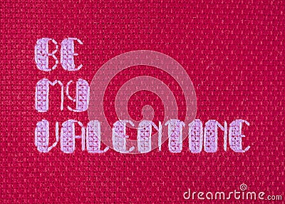 Be My Valentine cross stitched on red Stock Photo