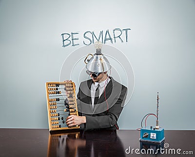 Be Smart text on blackboard with businessman Stock Photo