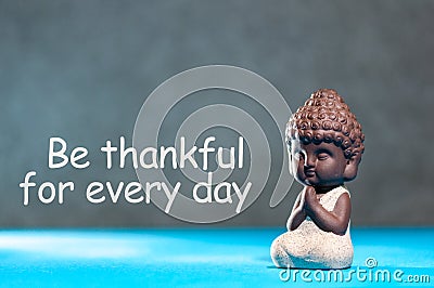 Be Thankful for every day - inspirational and motivating text near little buddha figurine Stock Photo