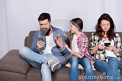 Be virtual for foreseeable future. Family pick up smartphones at home. Preparing child for future. Education and Stock Photo