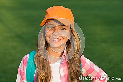 Be your own hipster. Happy little hipster on green grass. Hipster look of small girl. Cute child in hipster style Stock Photo