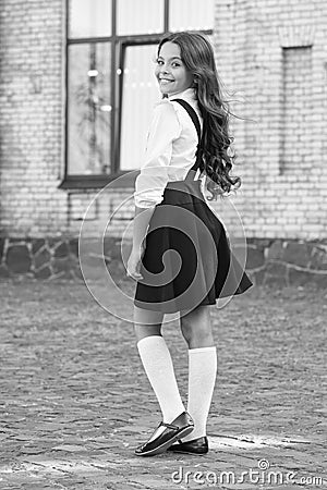 Be your own label. old school. back to school. childhood happiness. small happy girl ready to study. uniform market Stock Photo