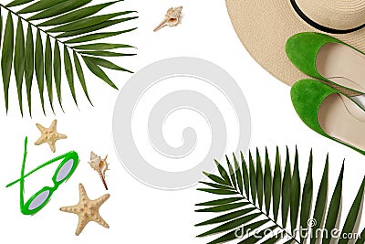 Beach accessories green color with tropical palm leaves on isola Stock Photo