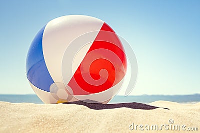 Beach ball on the sand Stock Photo