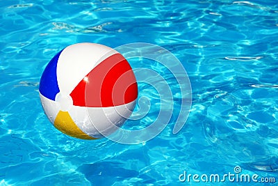 Beach ball in swimming pool Stock Photo