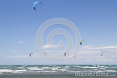 Beach Beauduc : Tourists and locals kitesurfing on large, remote beach with fine sand, popular destination in Southern France Editorial Stock Photo