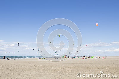 Beach Beauduc : Tourists and locals kitesurfing on large, remote beach with fine sand, popular destination in Southern France Editorial Stock Photo