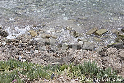 Sea surf line rocks and sand Stock Photo