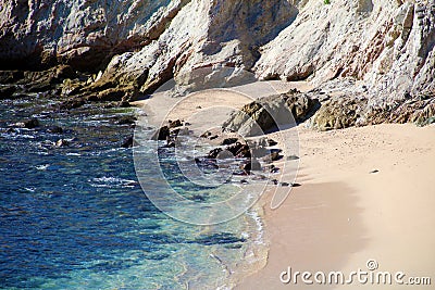 Beach blue green water ocean view at rocky cliff at california los cabos mexico nice hotel restaurant with fantastic views Stock Photo