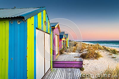 Beach cabins at sunset on Chelsea beach, Victoria, Australia Stock Photo