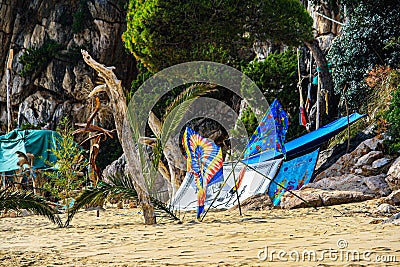 beach campsite with colorful towels, tents and sarongs Stock Photo