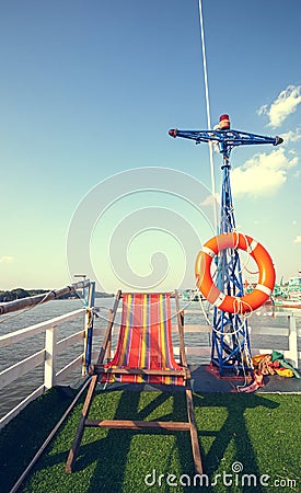 Beach chair on boat terrace for sunbathe midday Stock Photo