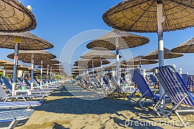 Beach chair and umbrella on sand beach Stock Photo