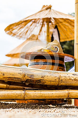 Beach chair and umbrella on sand beach. Concept for rest, relaxation, holidays, spa, resort Stock Photo