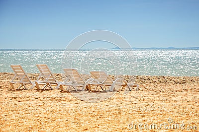 Beach chairs on the sand Stock Photo