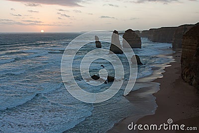The beach and the cliffs during the sunset at Twelve Apostles on the Great Ocean Road in Australia Stock Photo