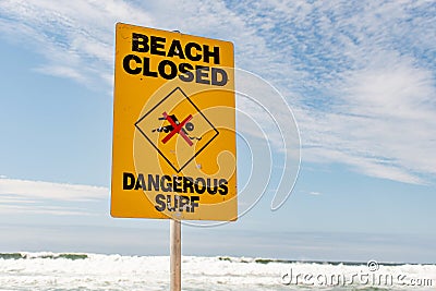 Beach closed and dangerous surf sign for swimmers in Australia Stock Photo