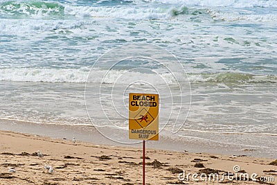 Beach closed and dangerous surf sign for swimmers in Australia Stock Photo