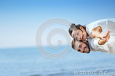 Beach couple laughing in love romance on travel honeymoon vacation Stock Photo