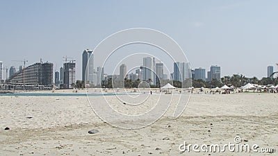 Beach in Dubai on the shore of the bay. United Arab Emirates. in the background is the construction of a new ultramodern area. Stock Photo