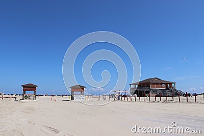 American beach lifestyle. A sandy beach with blue sky on the Gulf Coast, southern Texas, Galveston Island, USA. Editorial Stock Photo