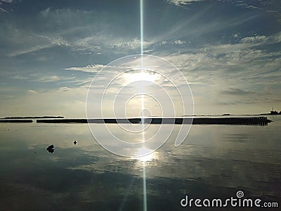 the beach in the evening the water recedes and it calm Stock Photo