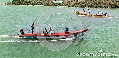 Beach with fishermen wooden motor boat.s Editorial Stock Photo