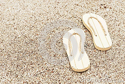 Beach flip flops on sandy beach. Summer concept. Fashion slaps. Stock Photo