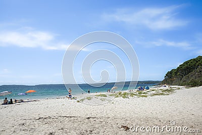 Beach-goers enjoying summer on white sand of Chinaman's Beach Editorial Stock Photo