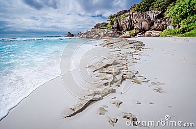 Beach Grand Anse on La Digue island, Seychelles. White sand and unique granite rock formation in background Stock Photo