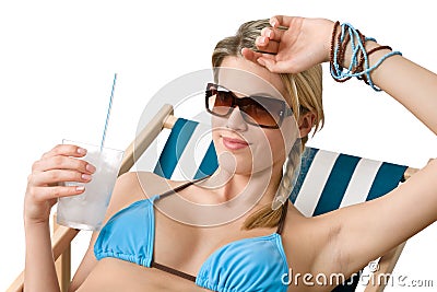 Beach - Happy woman in bikini with cold drink Stock Photo