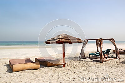 Beach with hut and sunbeds of the luxury hotel Stock Photo