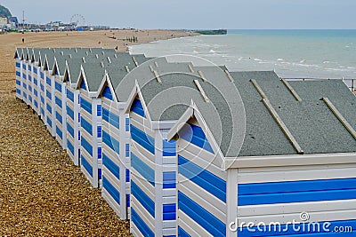 Brightly coloured beach huts on the beach at Hastings, Eangland UK Editorial Stock Photo