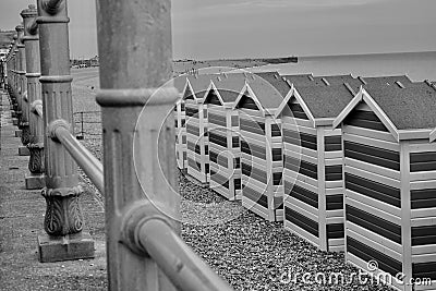 Monochrome image of beach huts on the beach at Hastings, Eangland UK Editorial Stock Photo