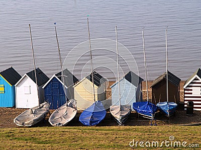 Beach huts and sailing Boats Stock Photo