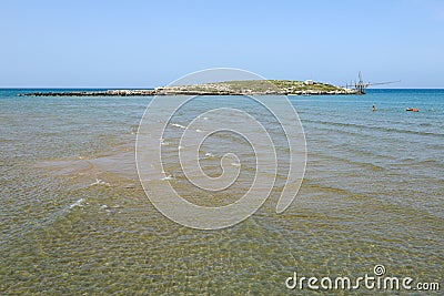 Beach and island on the coast of Torre Canne Editorial Stock Photo
