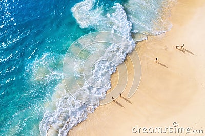 Beach and large ocean waves. Coast as a background from top view. Blue water background from drone. Summer seascape from air. Stock Photo