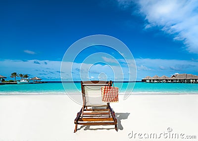 Beach lounger on sand beach. Stock Photo