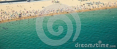 Beach with many people resting at Barcelona Stock Photo